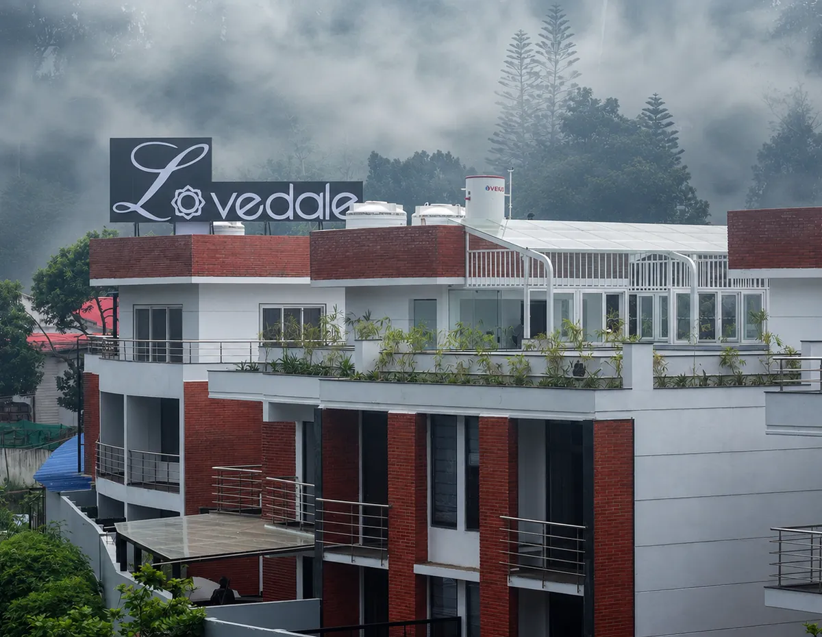 The Lovedale's façade with its illuminated sign, on the Kodaikanal hillside