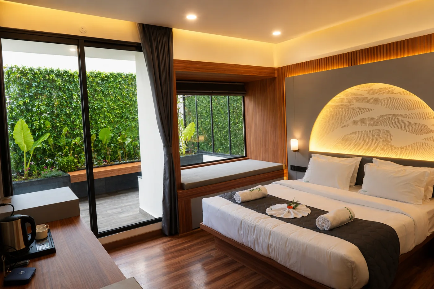 The Suite Room's private balcony at The Lovedale, framed by greenery