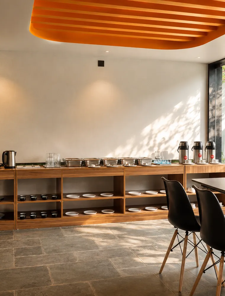 The Lovedale breakfast room in the morning light, buffet counter and dining tables